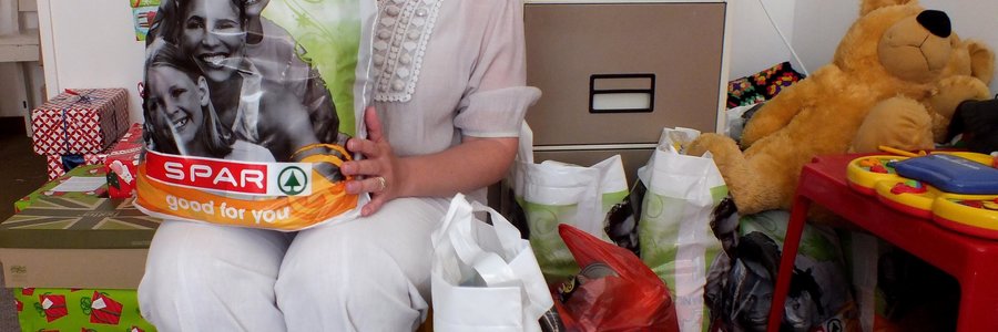 Heidi Kruger van Gansbaai Badisa sit dankbaar by etlike  Bags of Love wat alreeds ingedien is